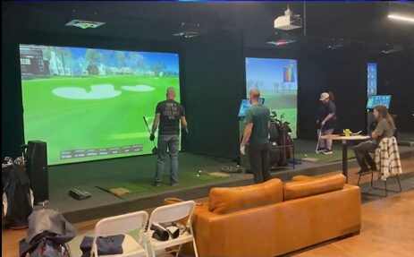A real Pin Seeker group gathered in a simulator bay