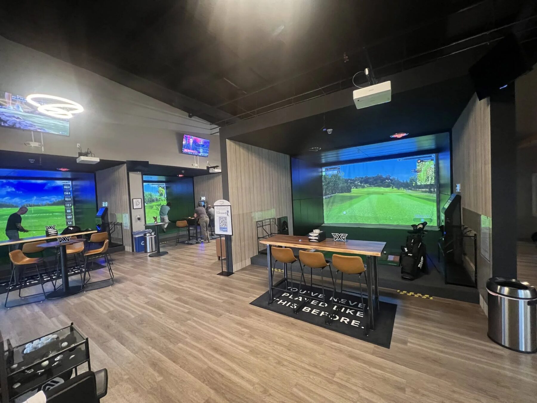 Pin Seeker Indoor Golf & Sports Grill venue with simulator bays and sports screens